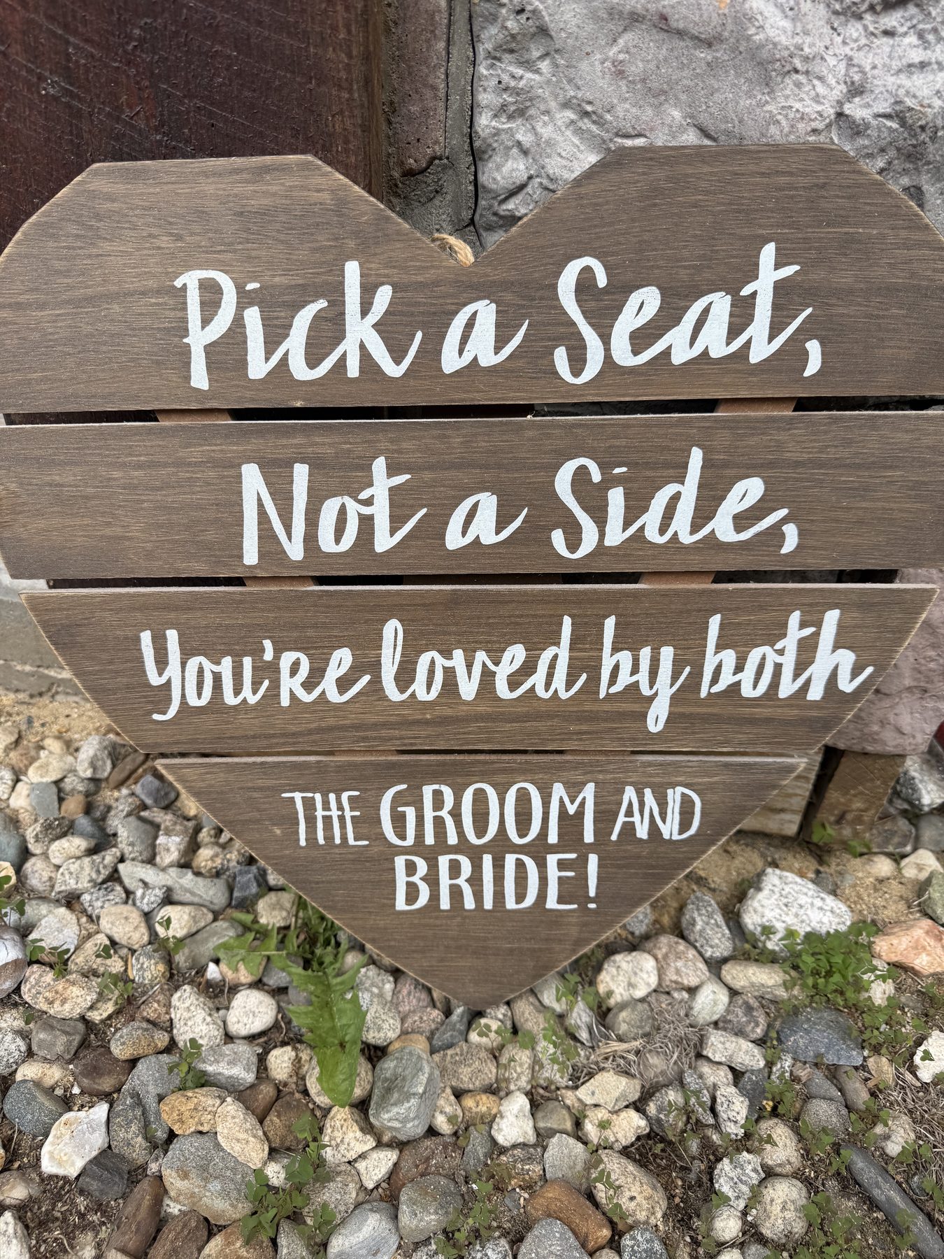 'Pick a seat, not a side' wedding sign