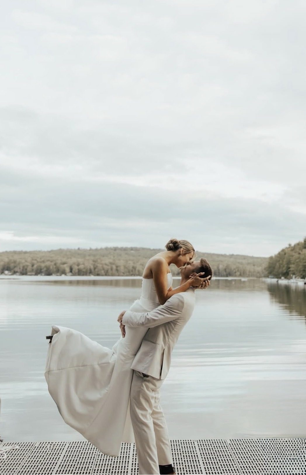 Wedding couple on the dock at Saturday Pond